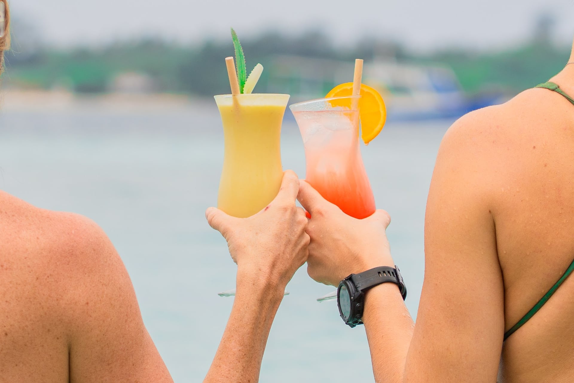 As the sun dips below the horizon, enjoy a refreshing cocktail while…