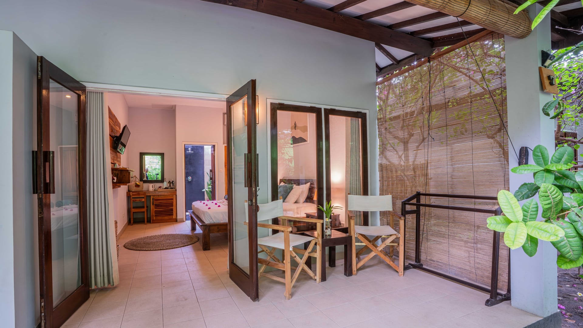 Sunlight shimmers on our freshwater pool, surrounded by lush tropical…