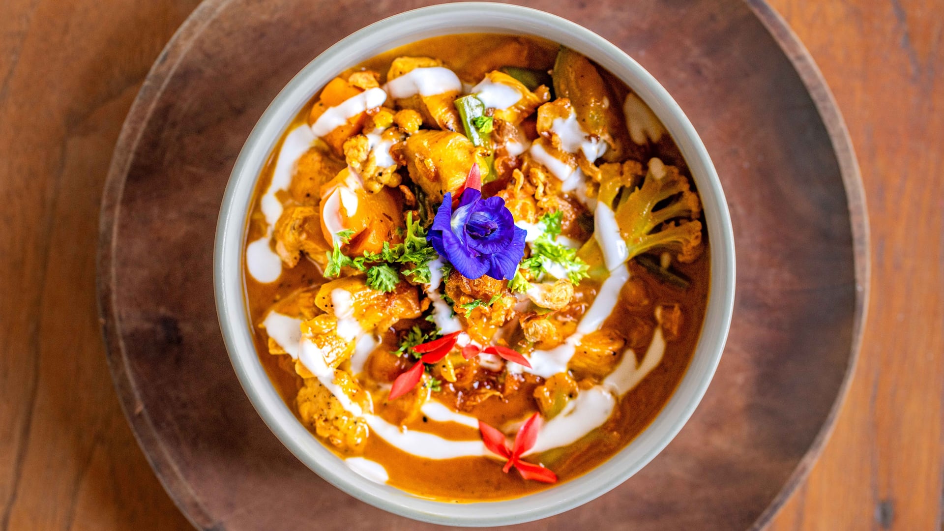 Breathe in the aroma of our signature Chicken Curry, a dish that brin…